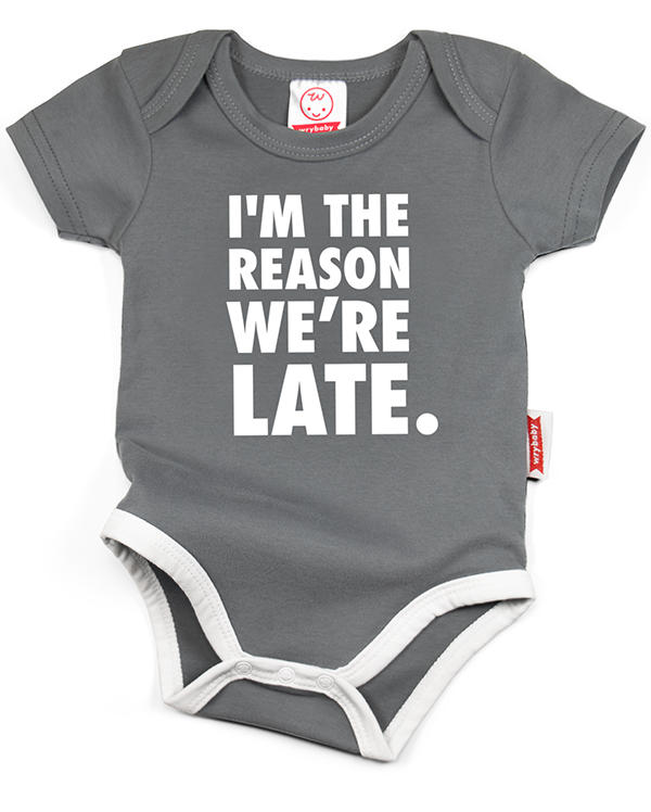 A gray cotton funny onesie made by wrybaby with 'I'm the Reason We're Late' printed on the front in a nice design