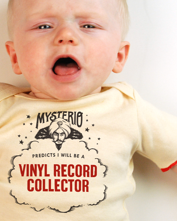 A baby wearing wrybaby's funny fortune teller t-shirt that says 'Mysterio Predicts I will be a Vinyl Record Collector'