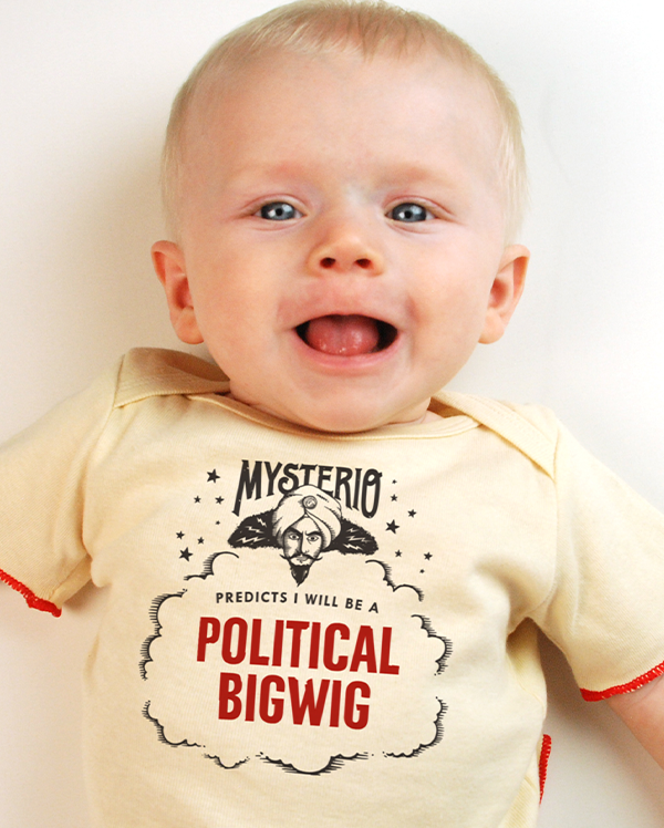 A baby wearing wrybaby's funny fortune teller t-shirt that says 'Mysterio Predicts I will be a Political Bigwig'