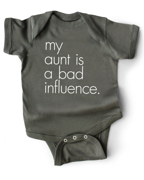A gray cotton funny onesie made by wrybaby with 'My Aunt is a Bad Influence' printed on the front in a nice design