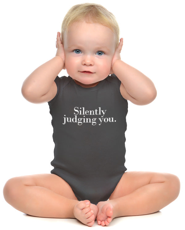 A baby wearing wrybaby's 'Silently Judging You' onesie