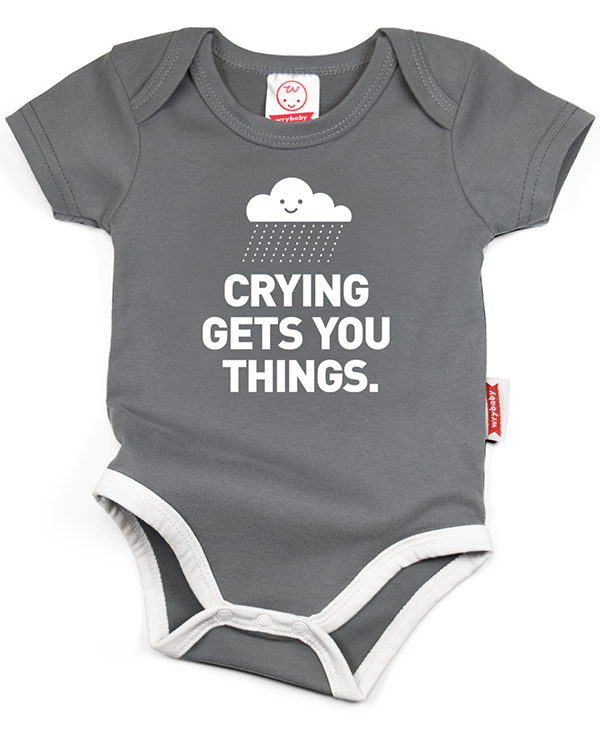 A gray cotton funny onesie made by wrybaby with 'Crying Gets You Things' printed on the front in a nice design