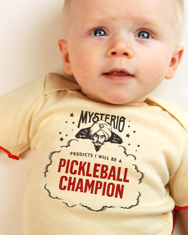 A baby wearing wrybaby's funny fortune teller t-shirt that says 'Mysterio Predicts I will be a Pickleball Champion'
