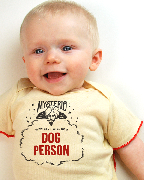 A baby wearing wrybaby's funny fortune teller t-shirt that says 'Mysterio Predicts I will be a Dog Person'