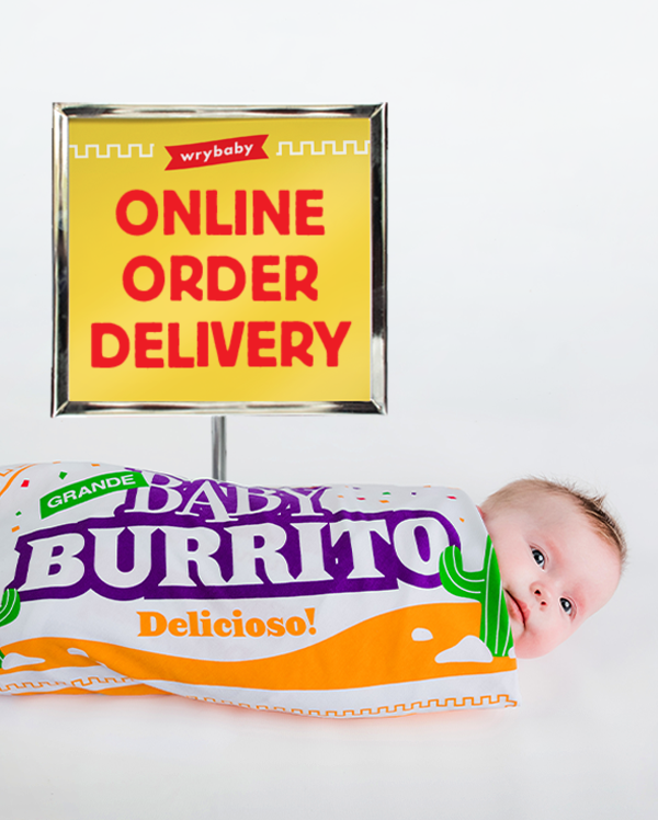 A baby bundled up in wrybaby's Baby Burrito Blanket, the swaddling blanket that looks like a fast food burrito wrapper