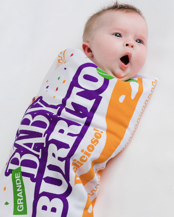A cute baby wrapped in Wrybaby's Baby Burrito WRapper swaddling blanket